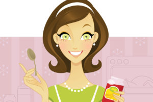 Happy smiling brunette mama holding jam and a spoon