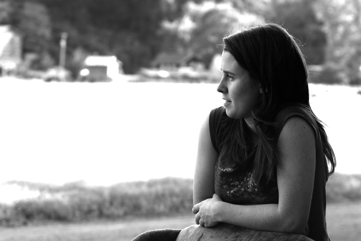 Teenage girl sitting alone and thinking